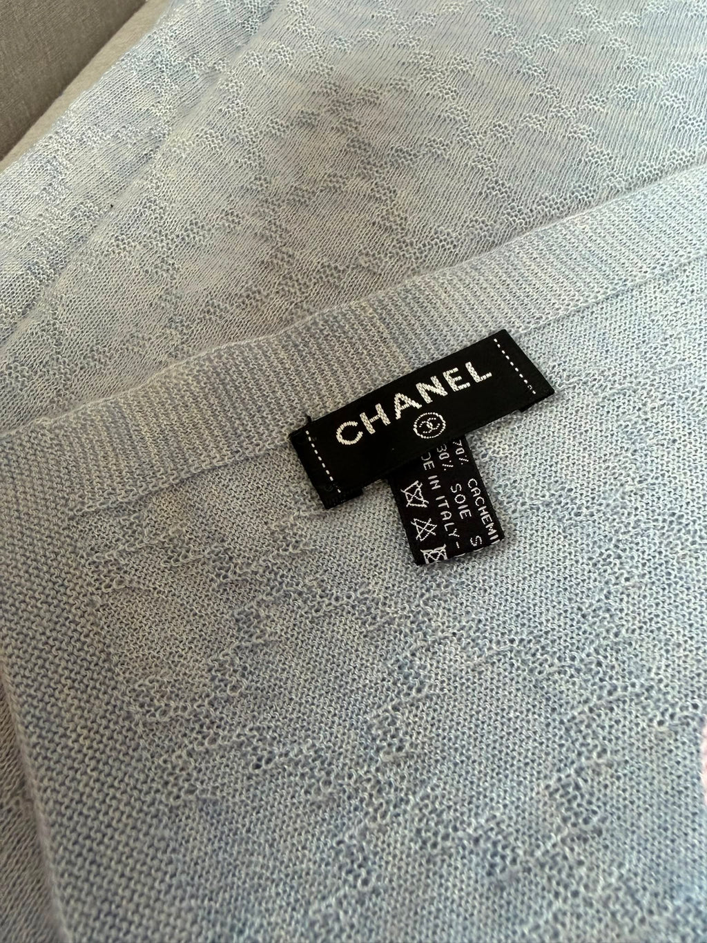 Authentic pre owned Chanel light blue scarf with pink CC logo