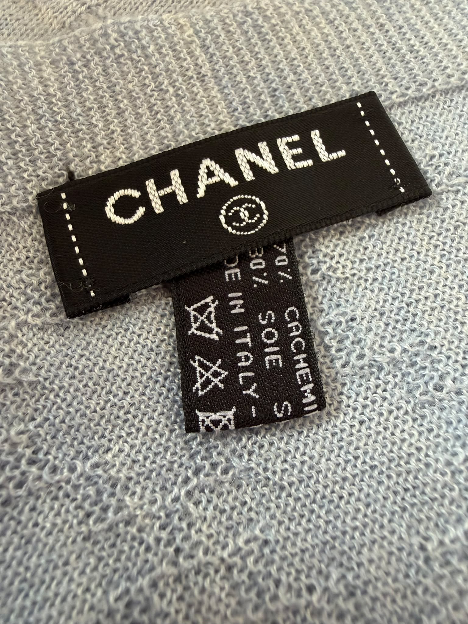 Authentic pre owned Chanel light blue scarf with pink CC logo