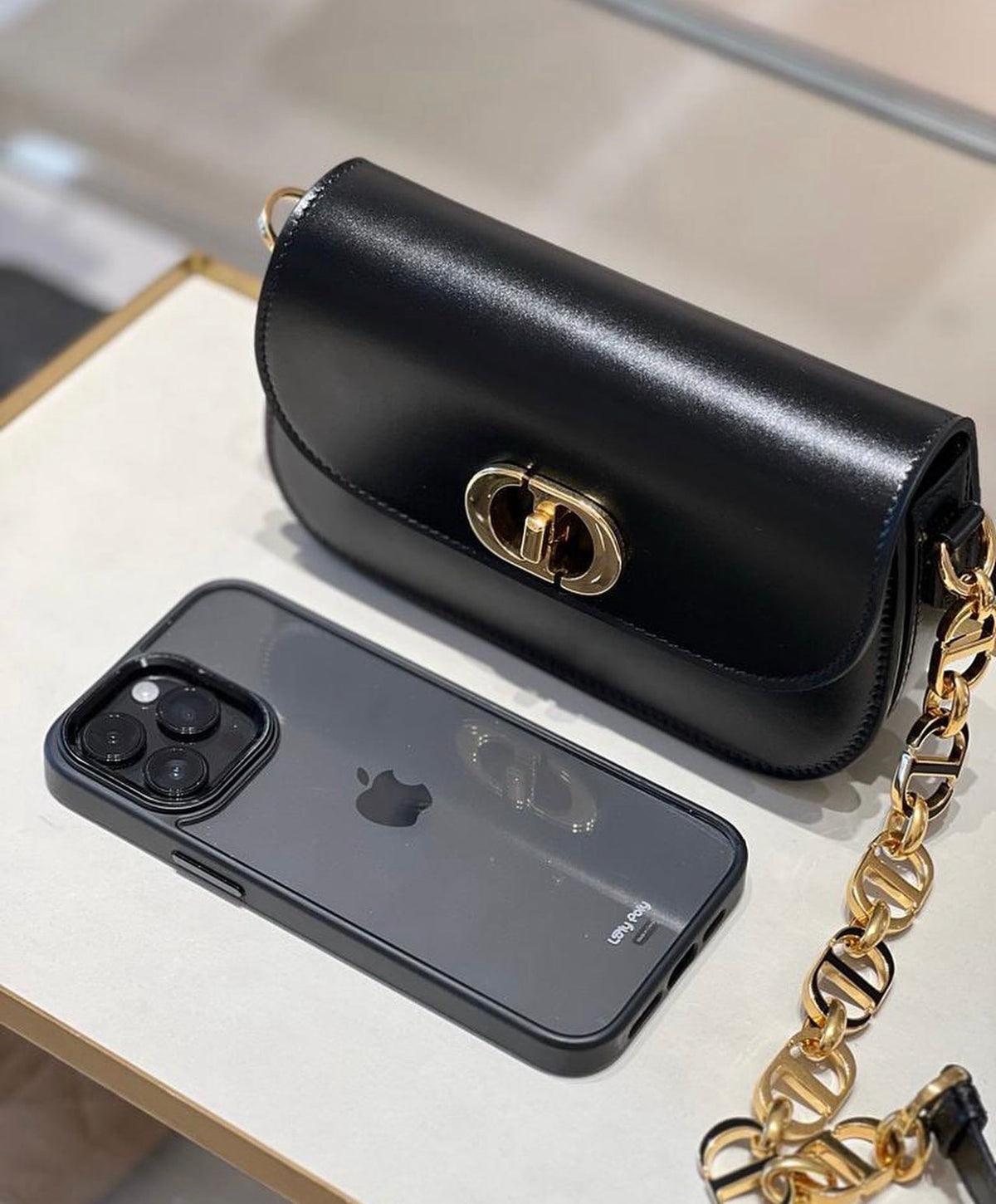 Christian Dior Small 30 Montaigne Avenue Bag – Black front view To show with iPhone pro max 