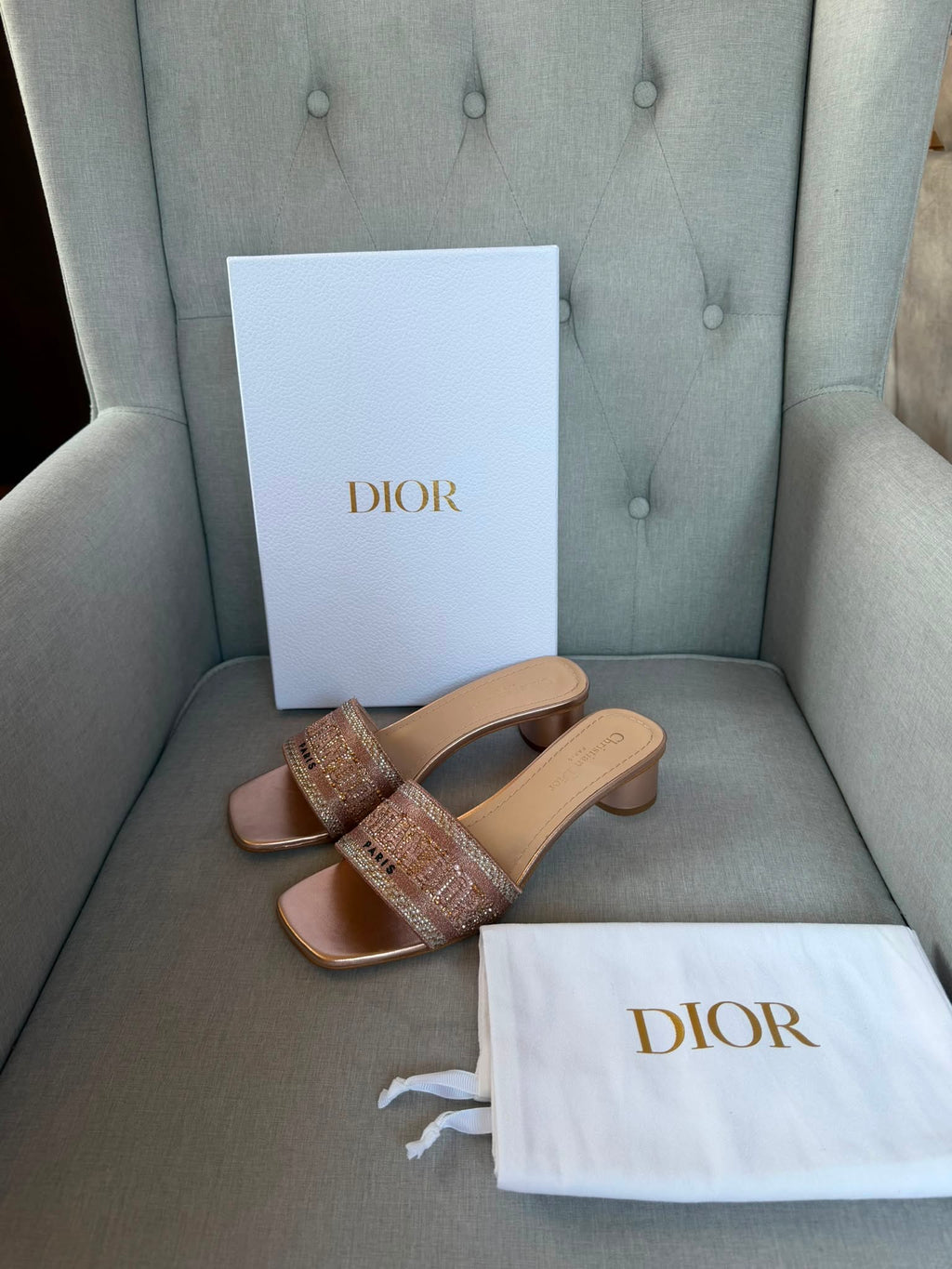 Dior rose gold embroidered crystal embellished sandal strap close-up.