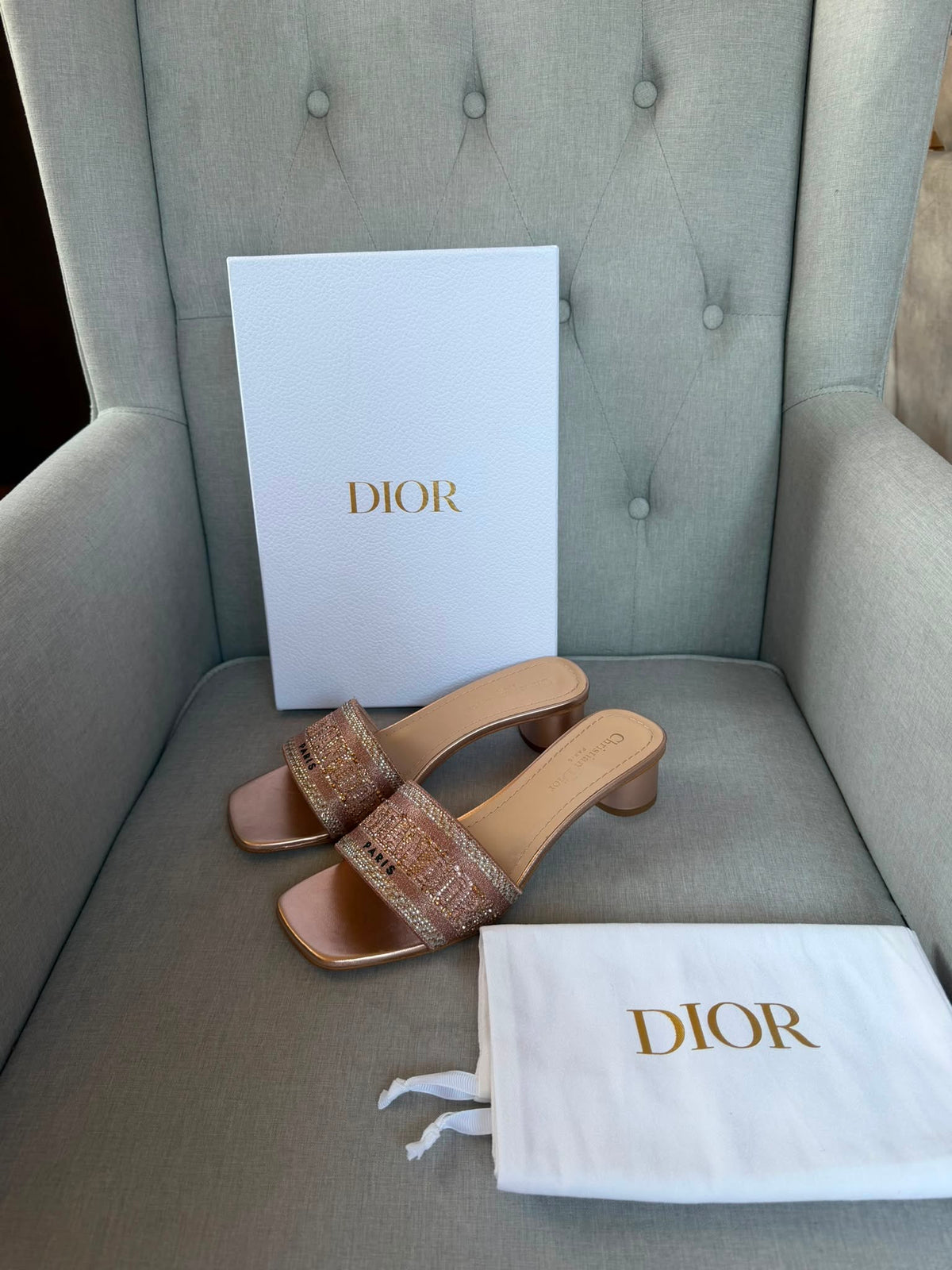 Dior rose gold embroidered crystal embellished sandal strap close-up.