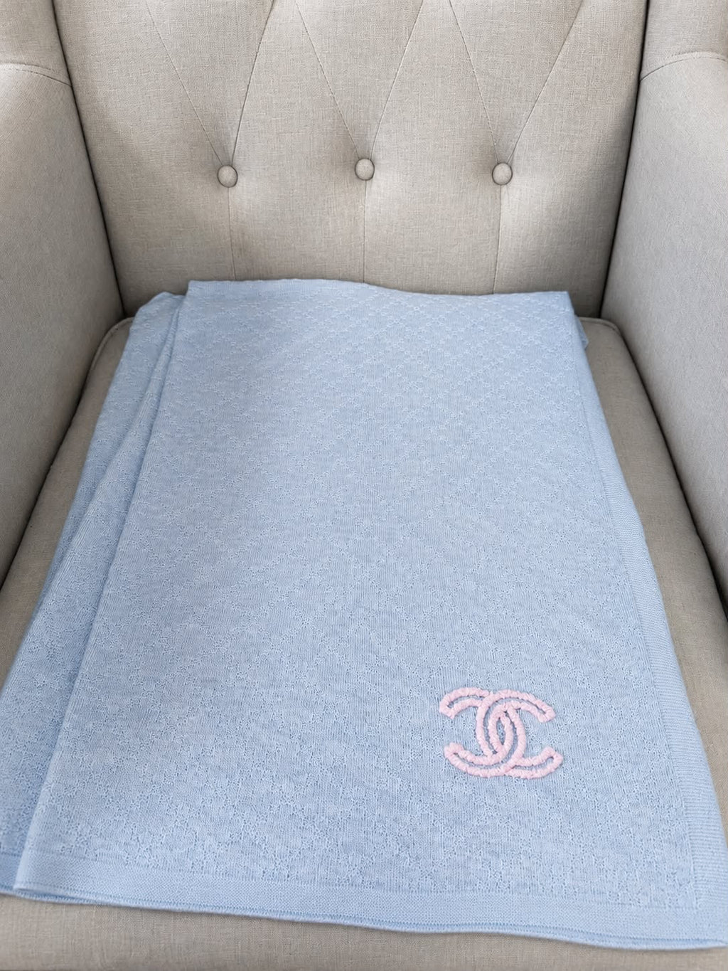 Authentic pre owned Chanel light blue scarf with pink CC logo