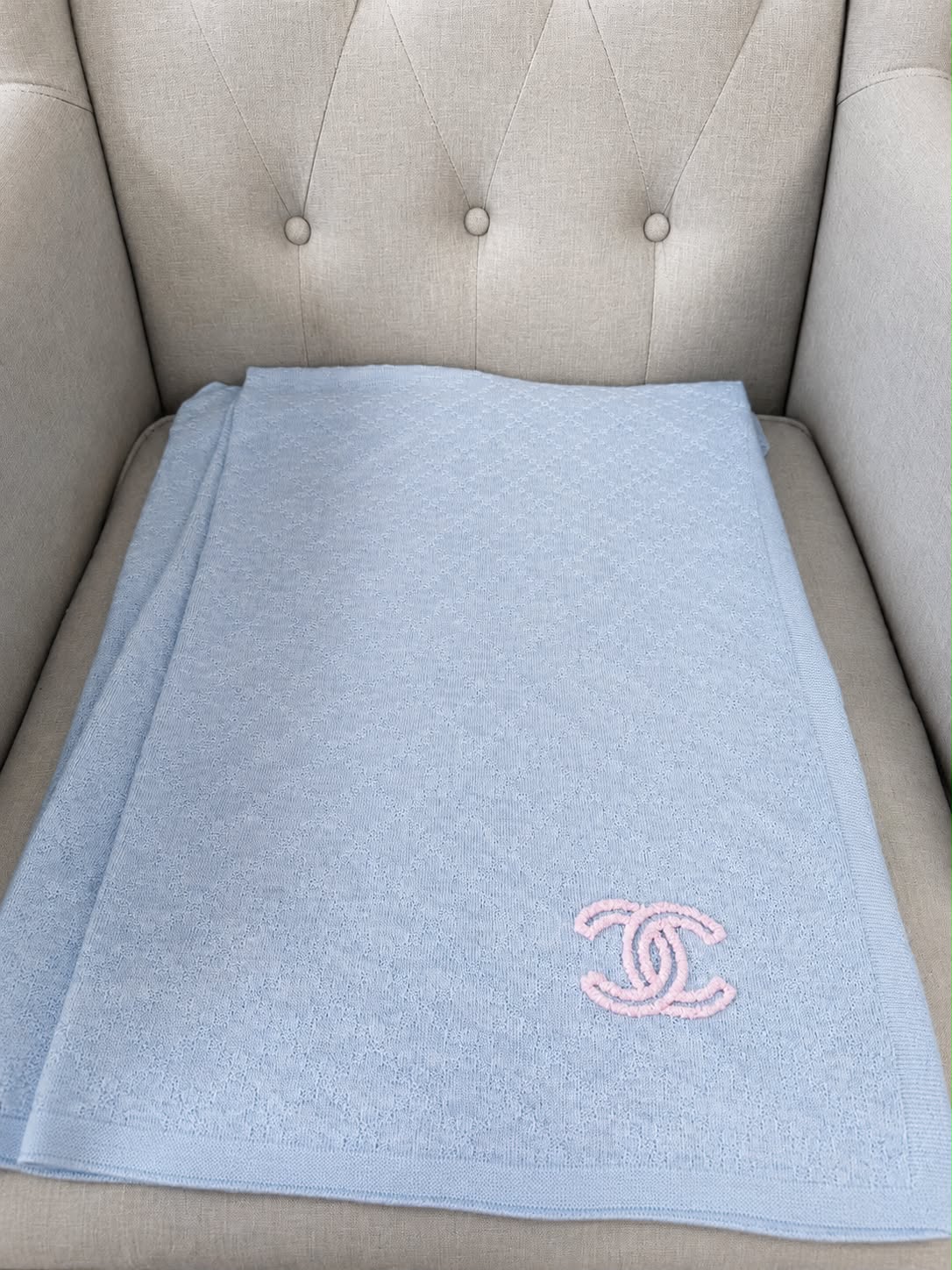 Authentic pre owned Chanel light blue scarf with pink CC logo