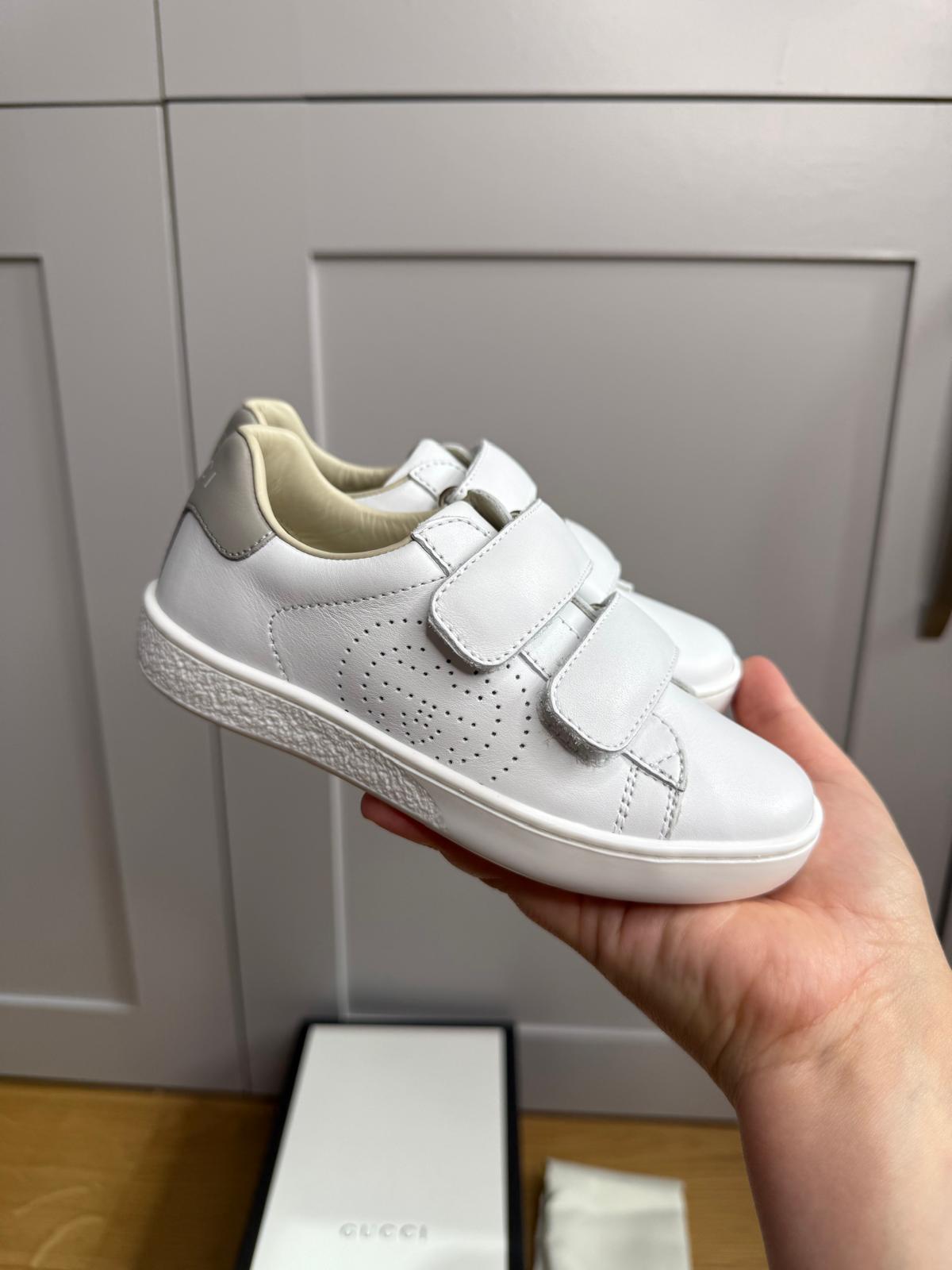 New Gucci GG Ace Junior Leather trainers with perforated GG and grey heel detail