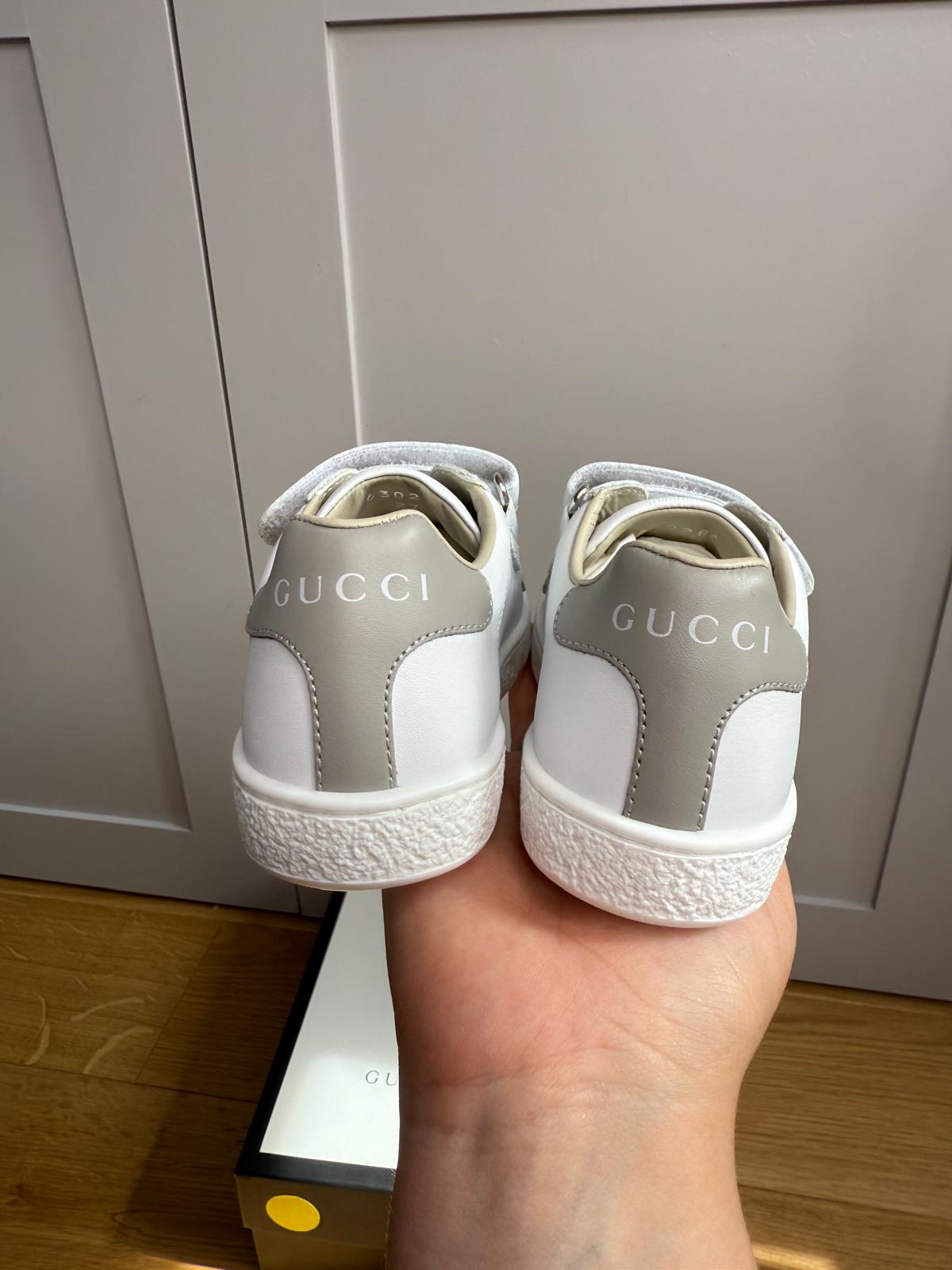 New Gucci GG Ace Junior Leather trainers with perforated GG and grey heel detail