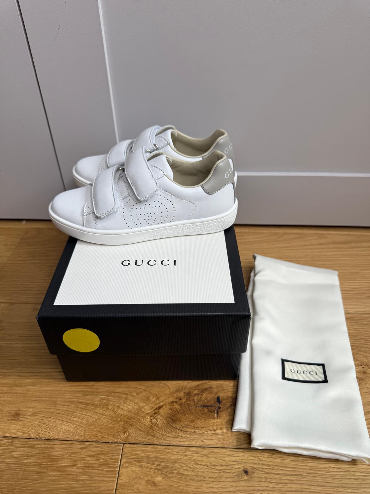 New Gucci GG Ace Junior Leather trainers with perforated GG and grey heel detail