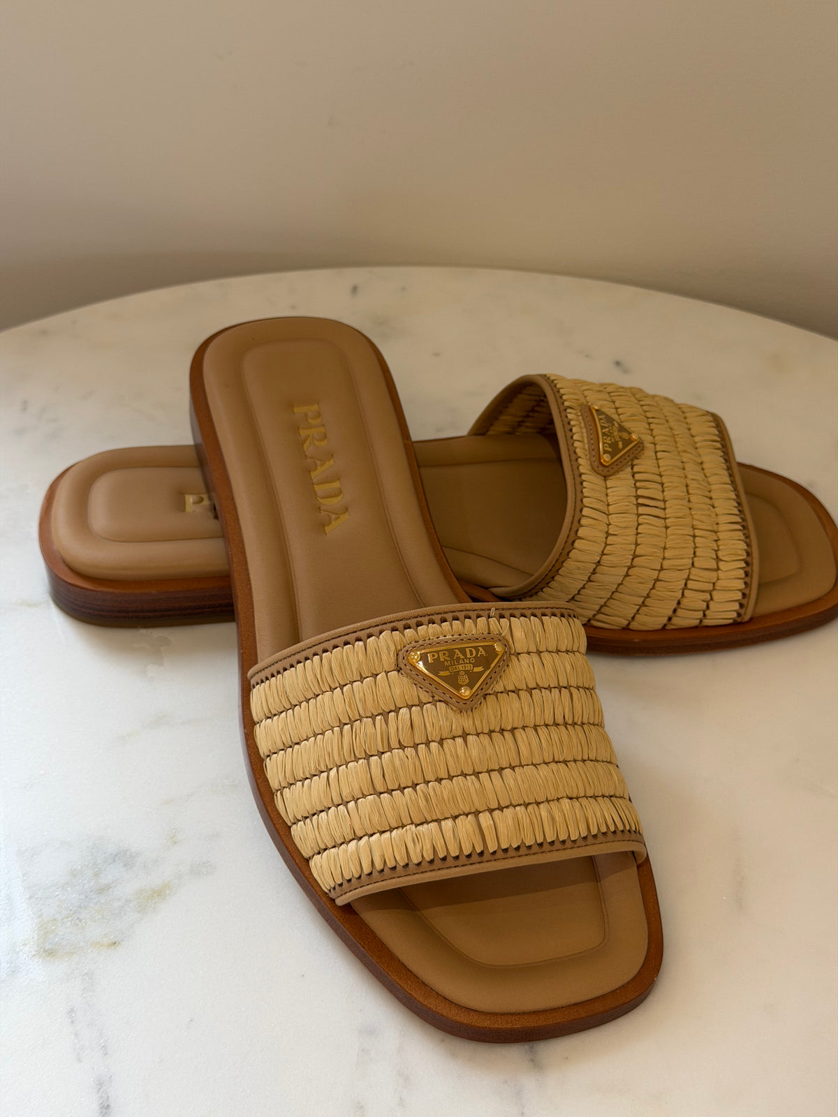 Ladies Prada raffia slides with triangle Prada logo 