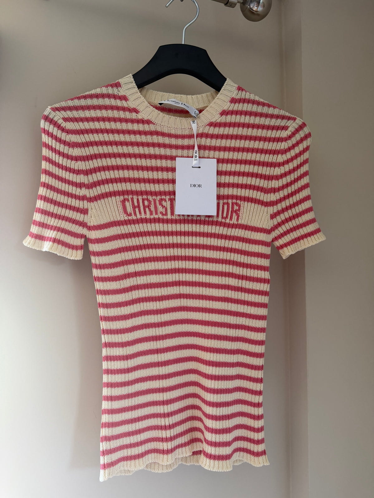 Christian Dior signature detail on white and coral striped sweater