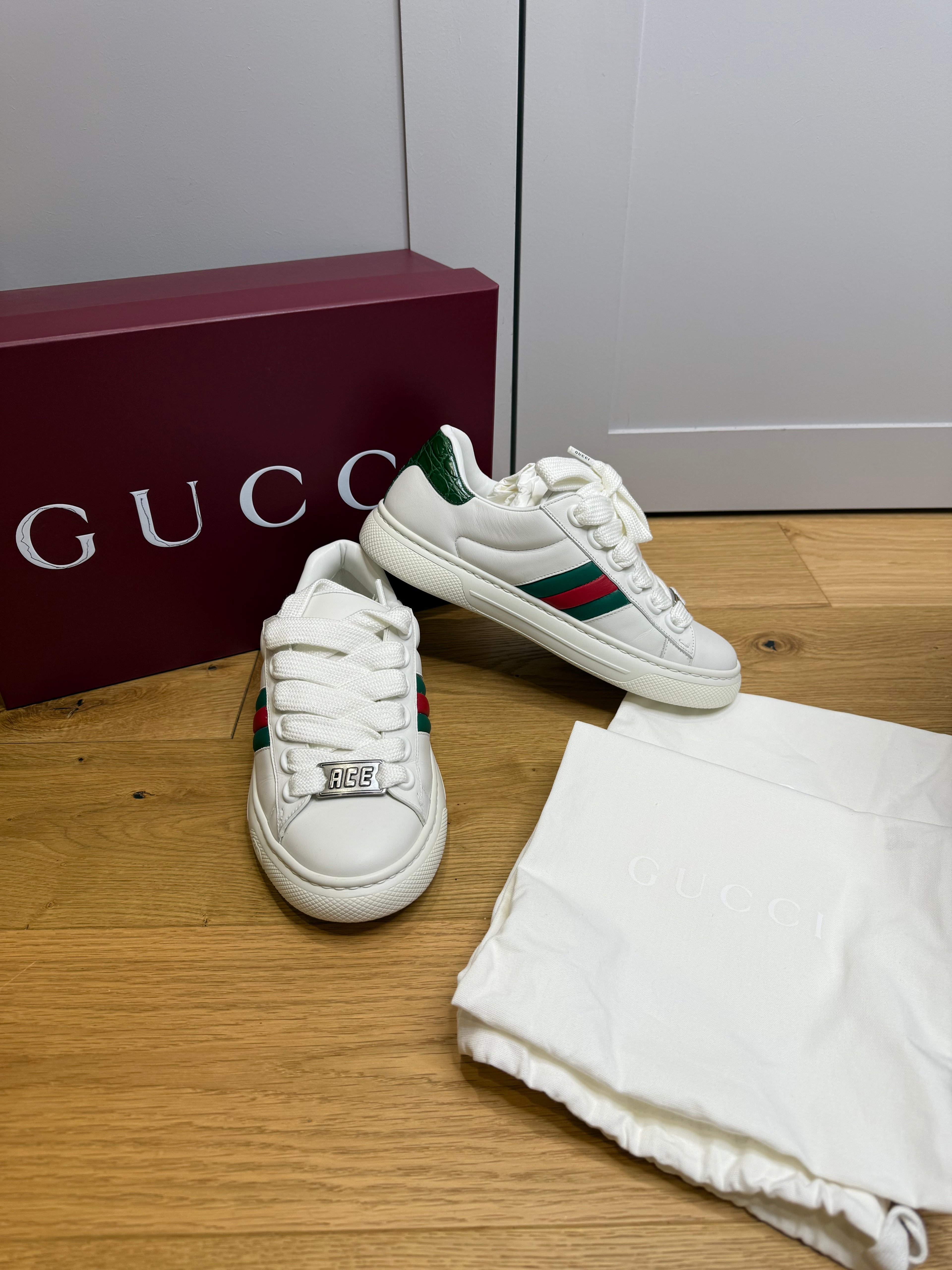 Front view of Gucci Ace women’s white leather trainers with green and red web stripe size EU 38