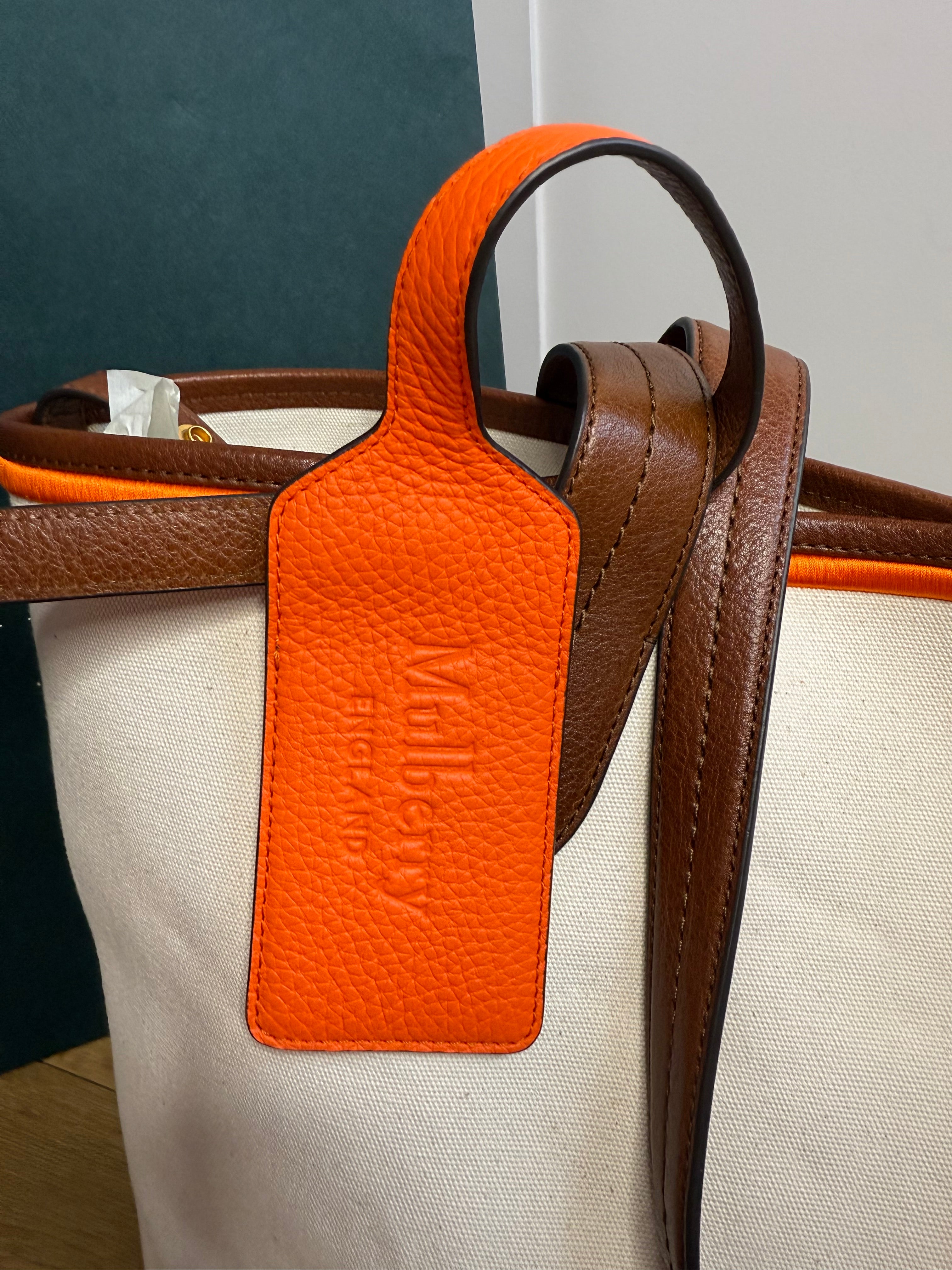 Side profile of Mulberry canvas tote with leather trim