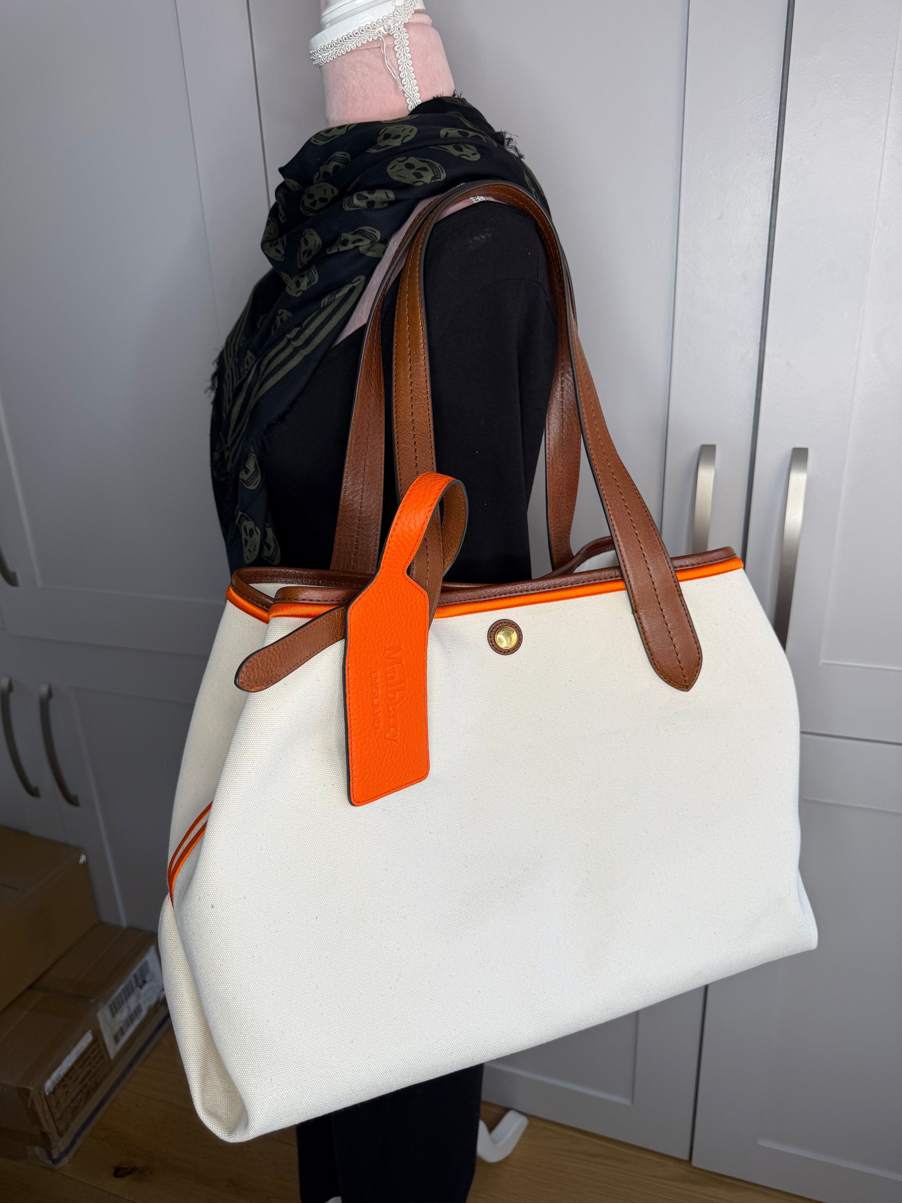 Leather handle detail on Mulberry canvas tote bag