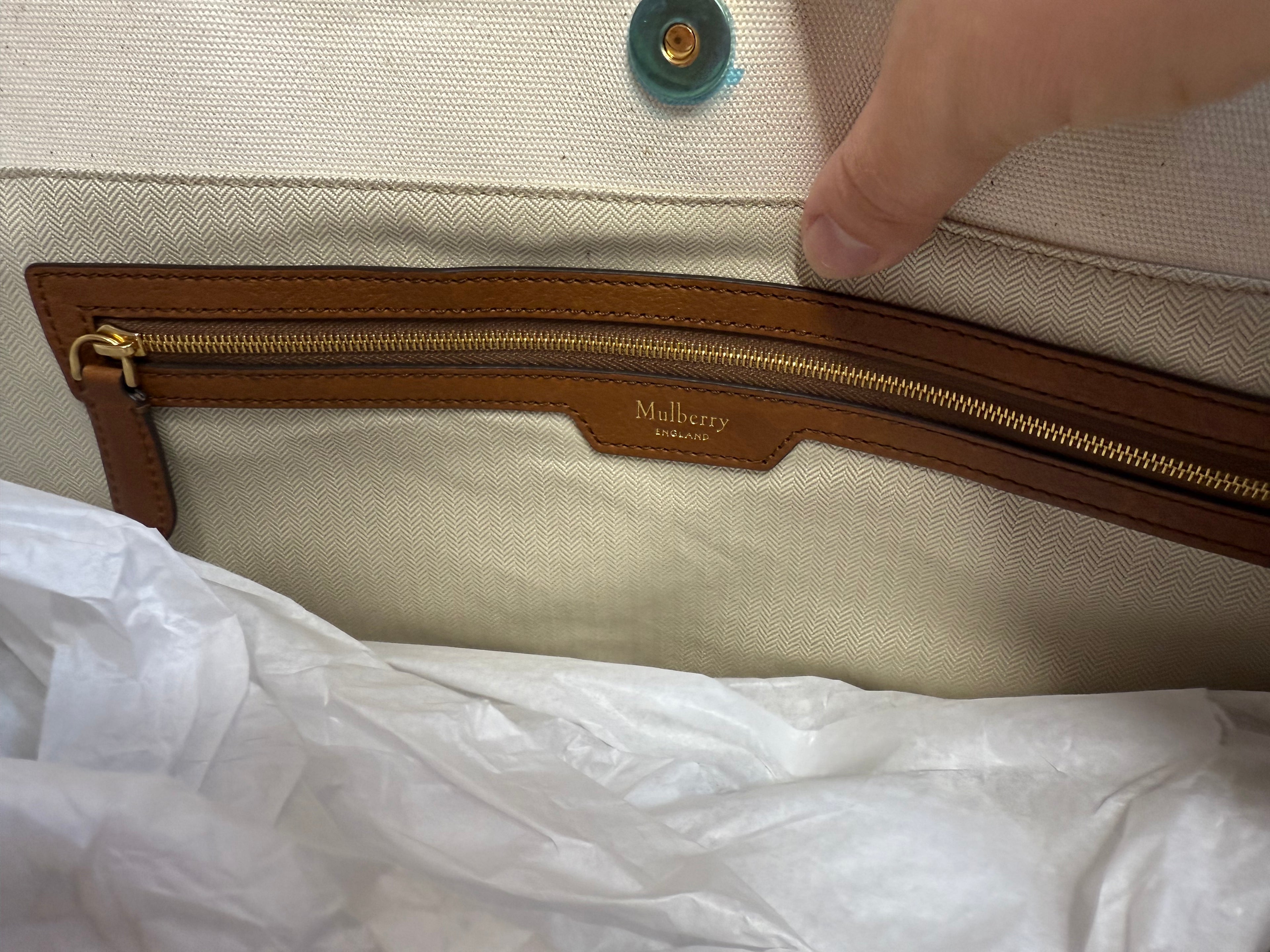 Interior pocket detail inside Mulberry canvas tote bag