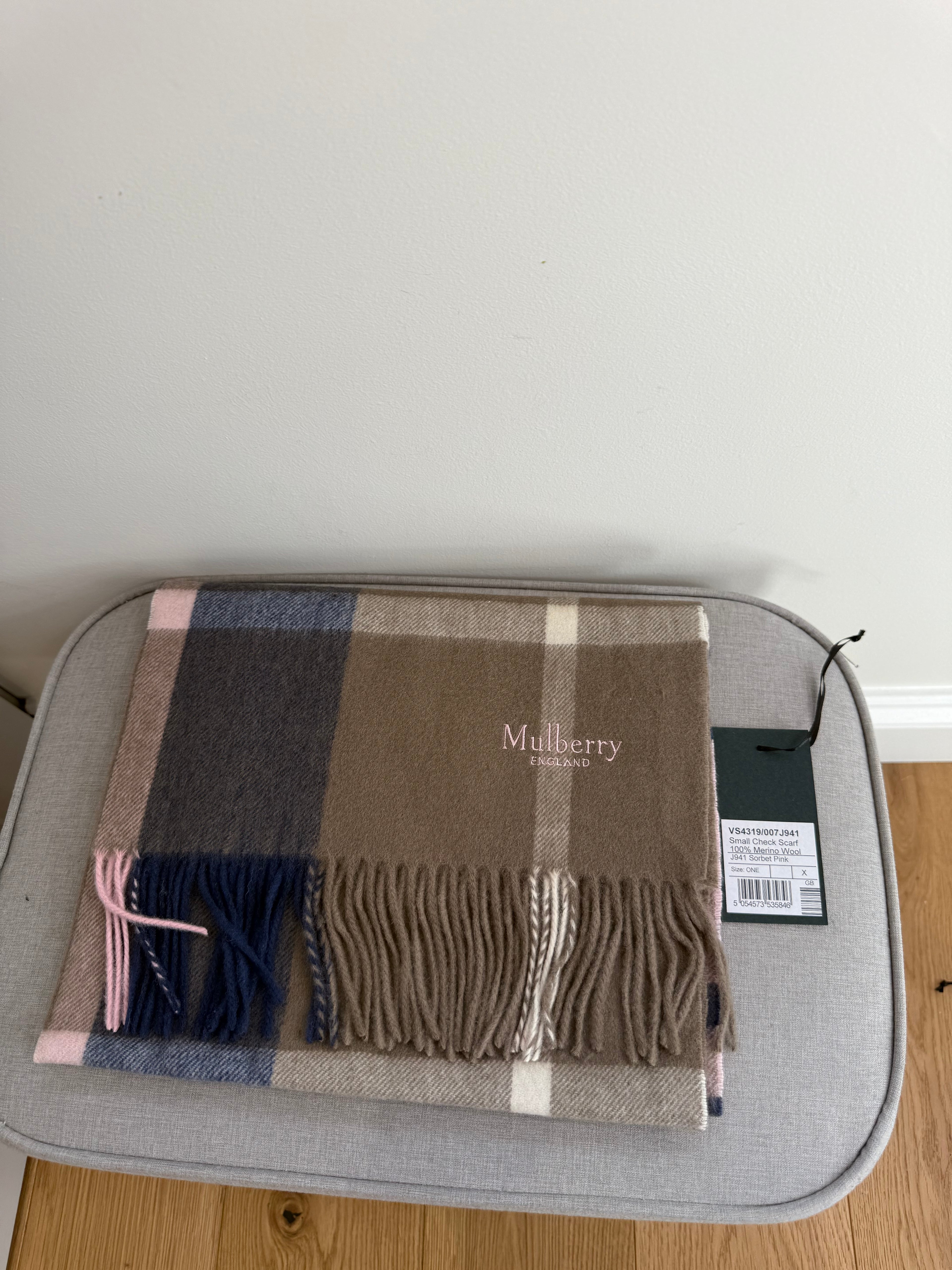 Close up of lambswool weave on Mulberry khaki and berry check scarf