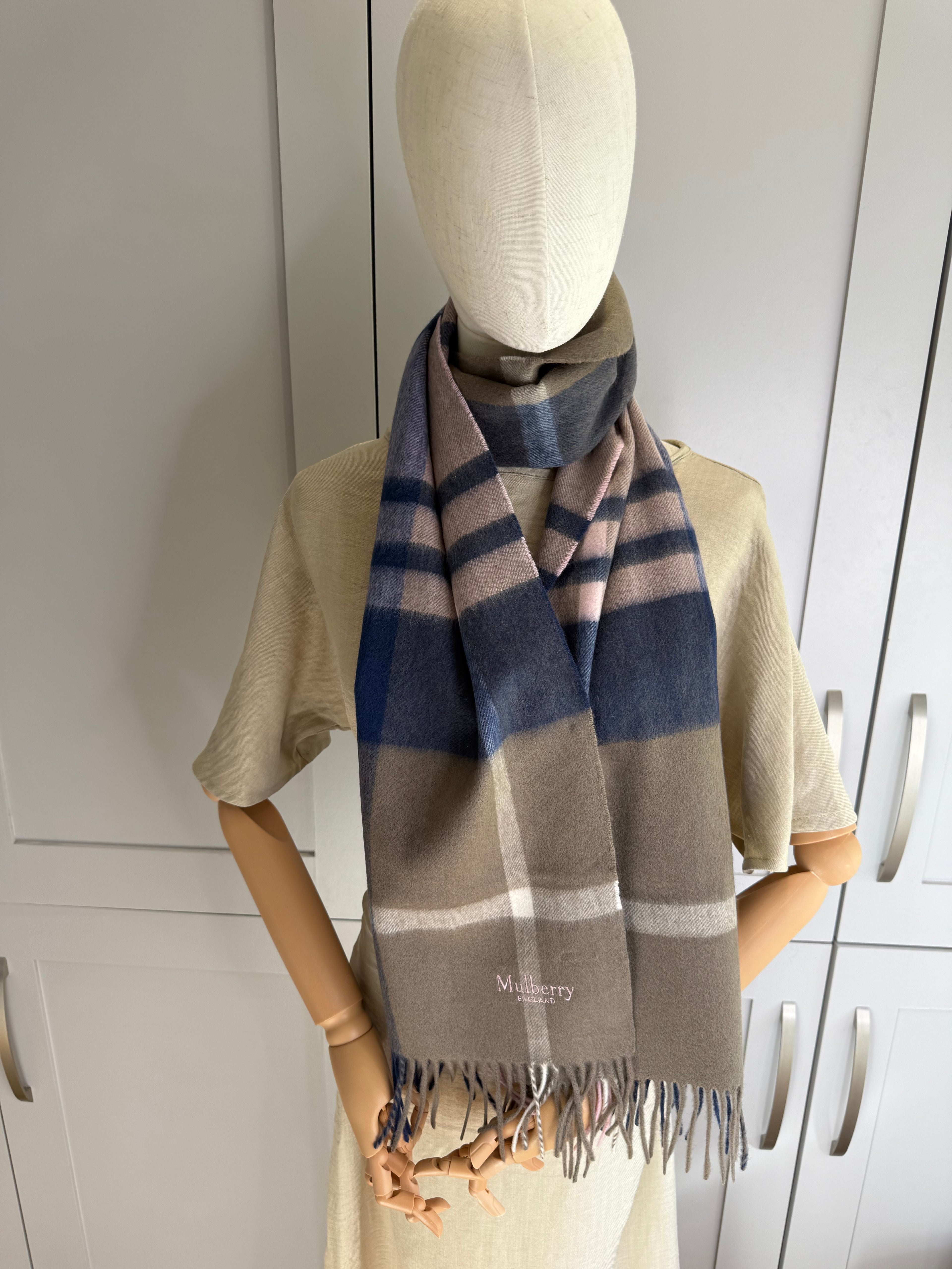 Close up of lambswool weave on Mulberry khaki and berry check scarf