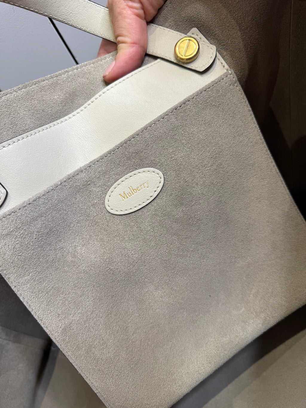 Wide interior view of Mulberry M Zipped Tote bag in chalk with suede lining
