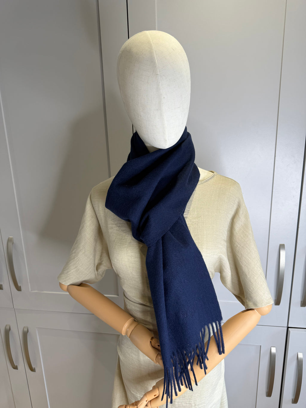 Authenticity tag on Mulberry navy blue merino wool scarf
