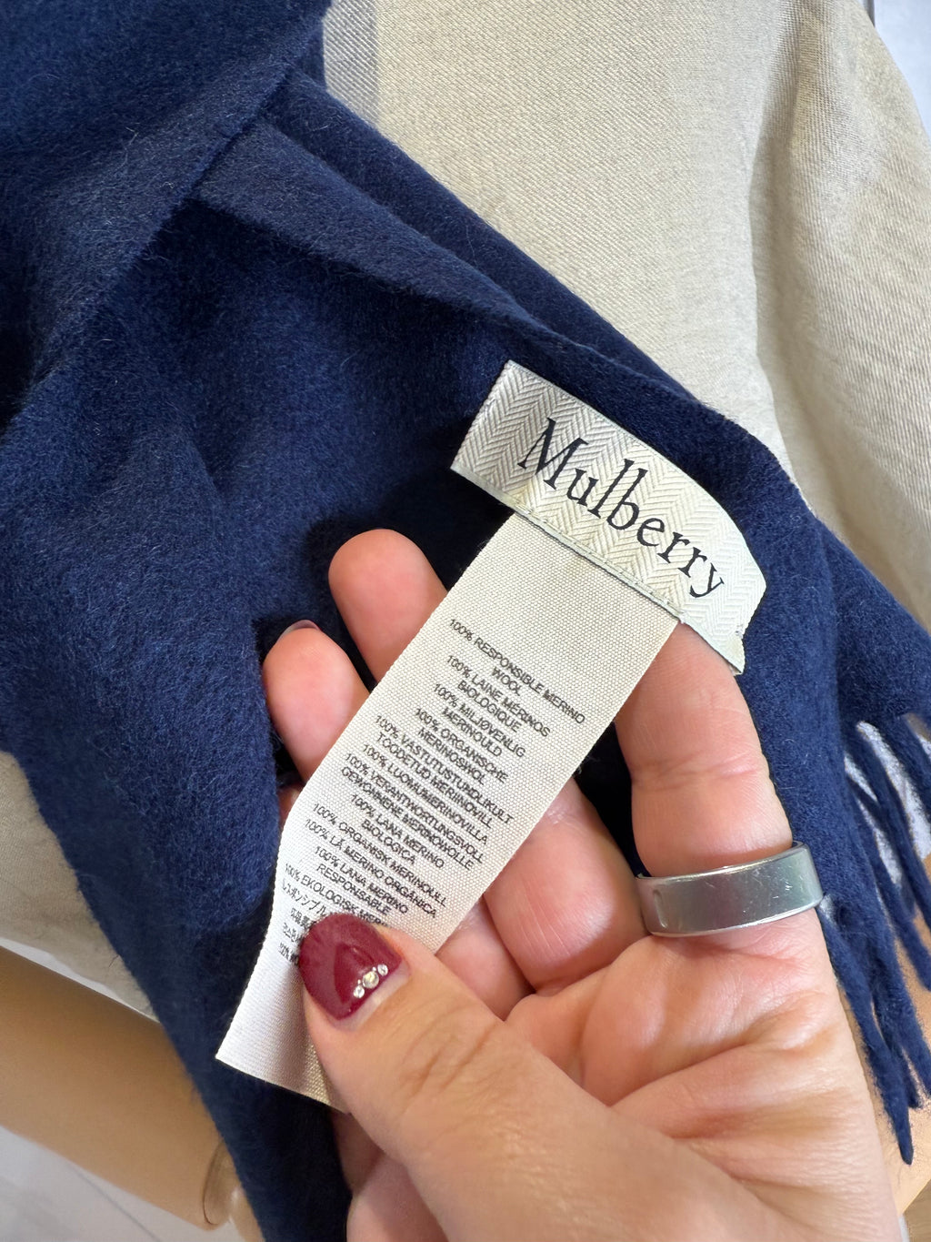 Fringe detail on Mulberry navy blue merino wool scarf