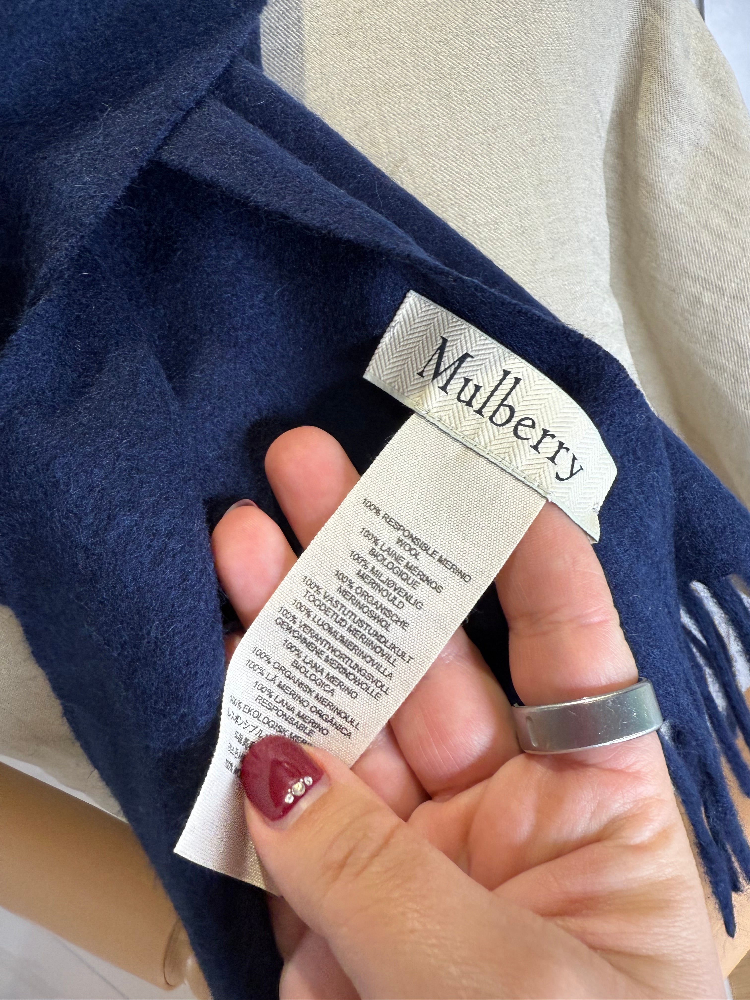 Fringe detail on Mulberry navy blue merino wool scarf